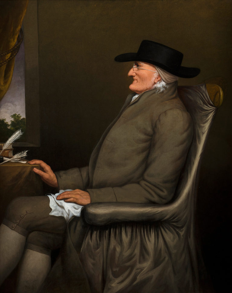 Profile paintaing of an elderly white man in a grey suit and broad-brimmed hat looking out the window.